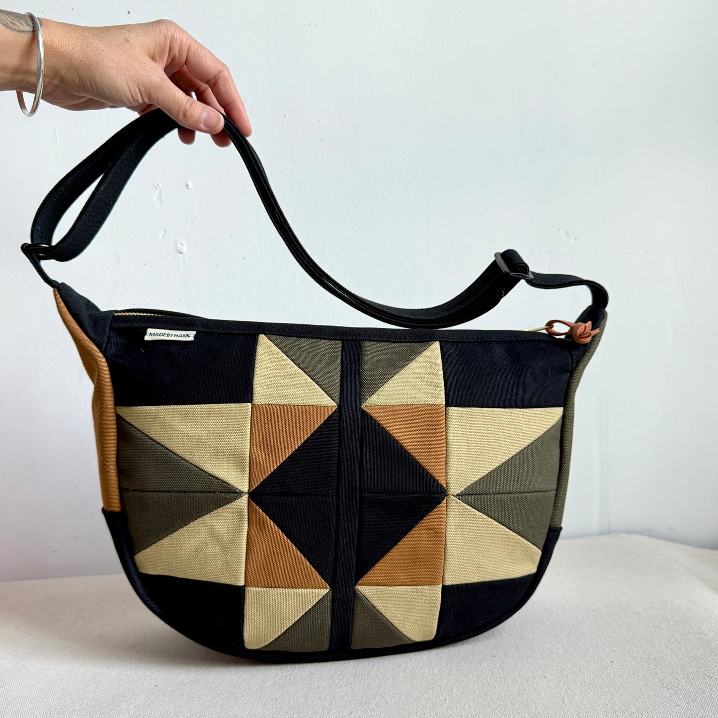 crescent shoulder bag, black with honey/ forest/caramel