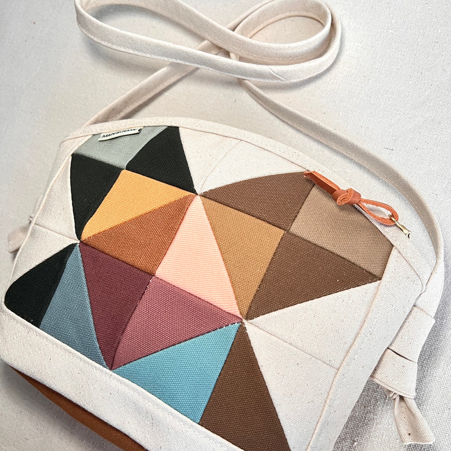 rounded-top crossbody, muted multi (natural)