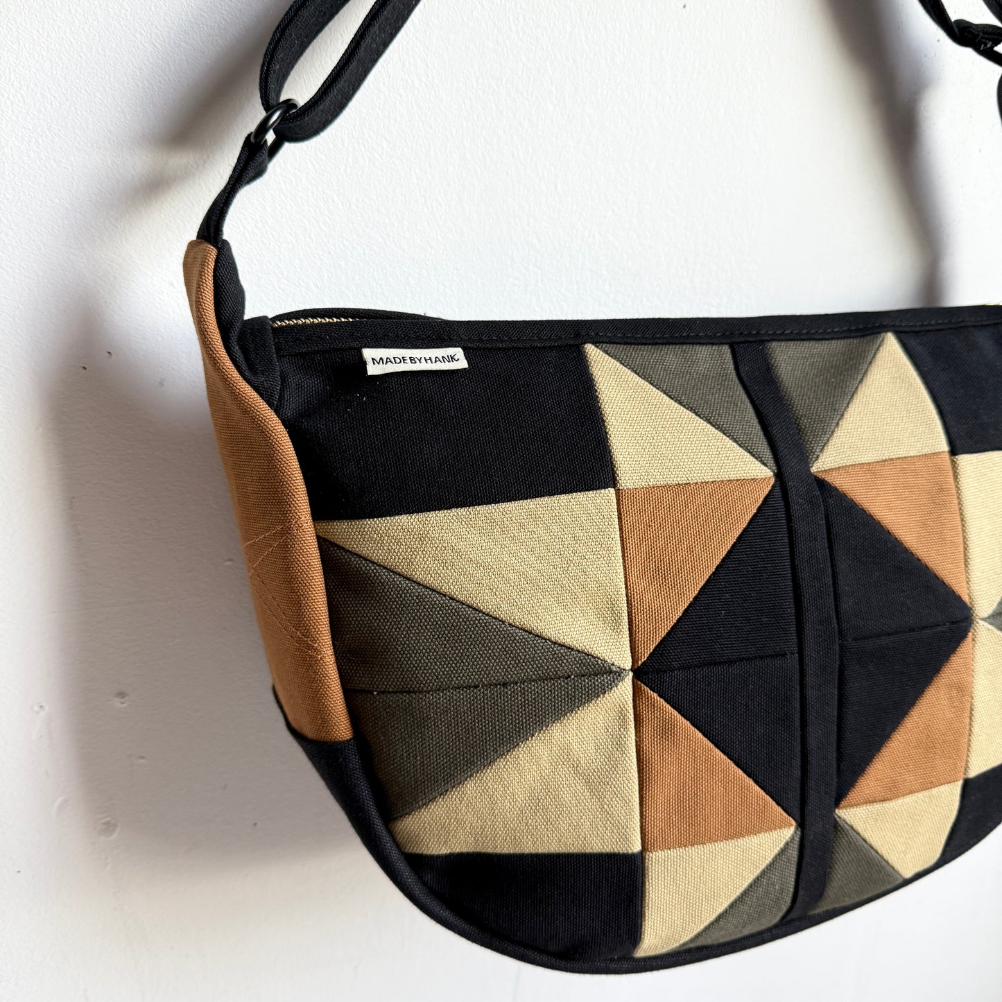 crescent shoulder bag, black with honey/ forest/caramel