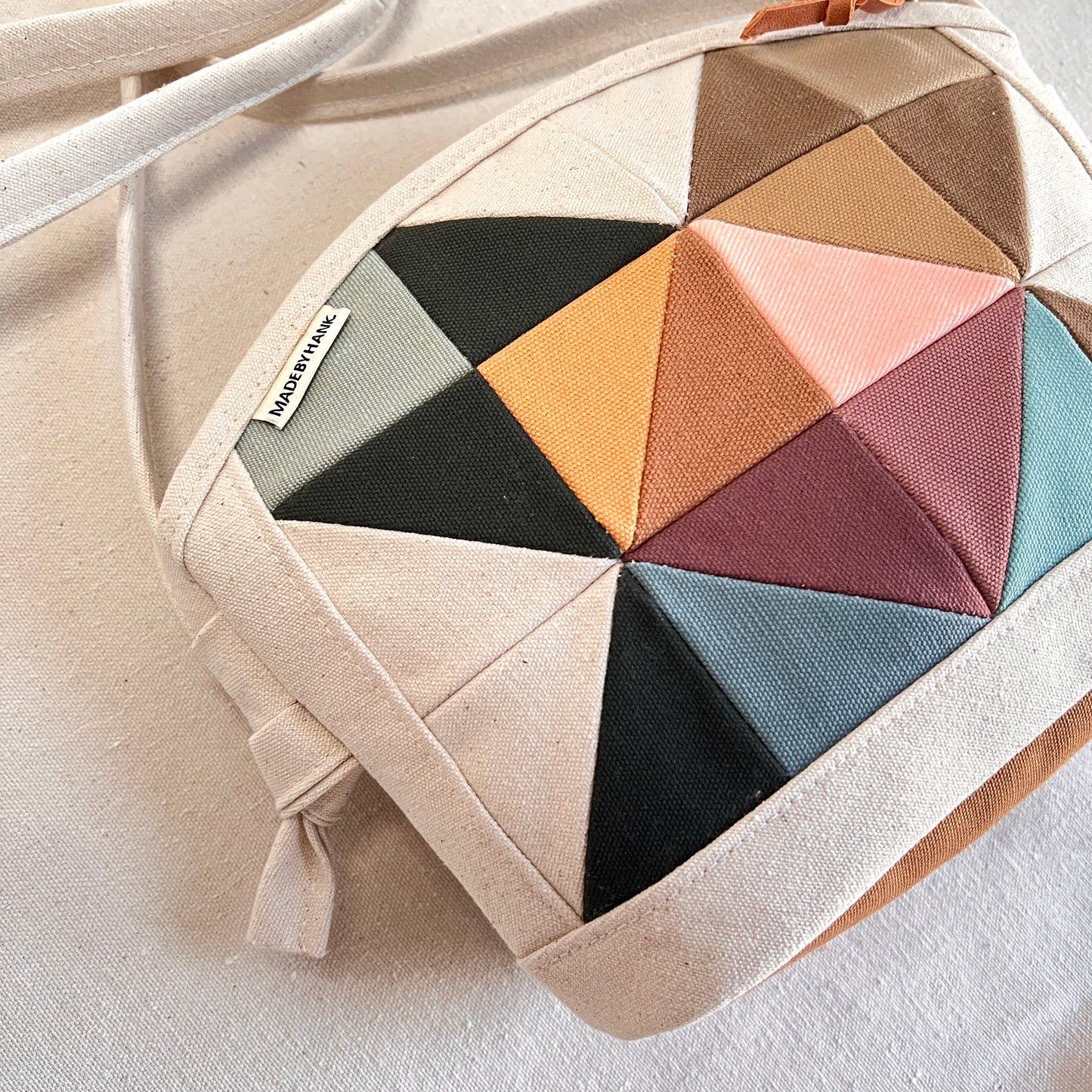 rounded-top crossbody, muted multi (natural)