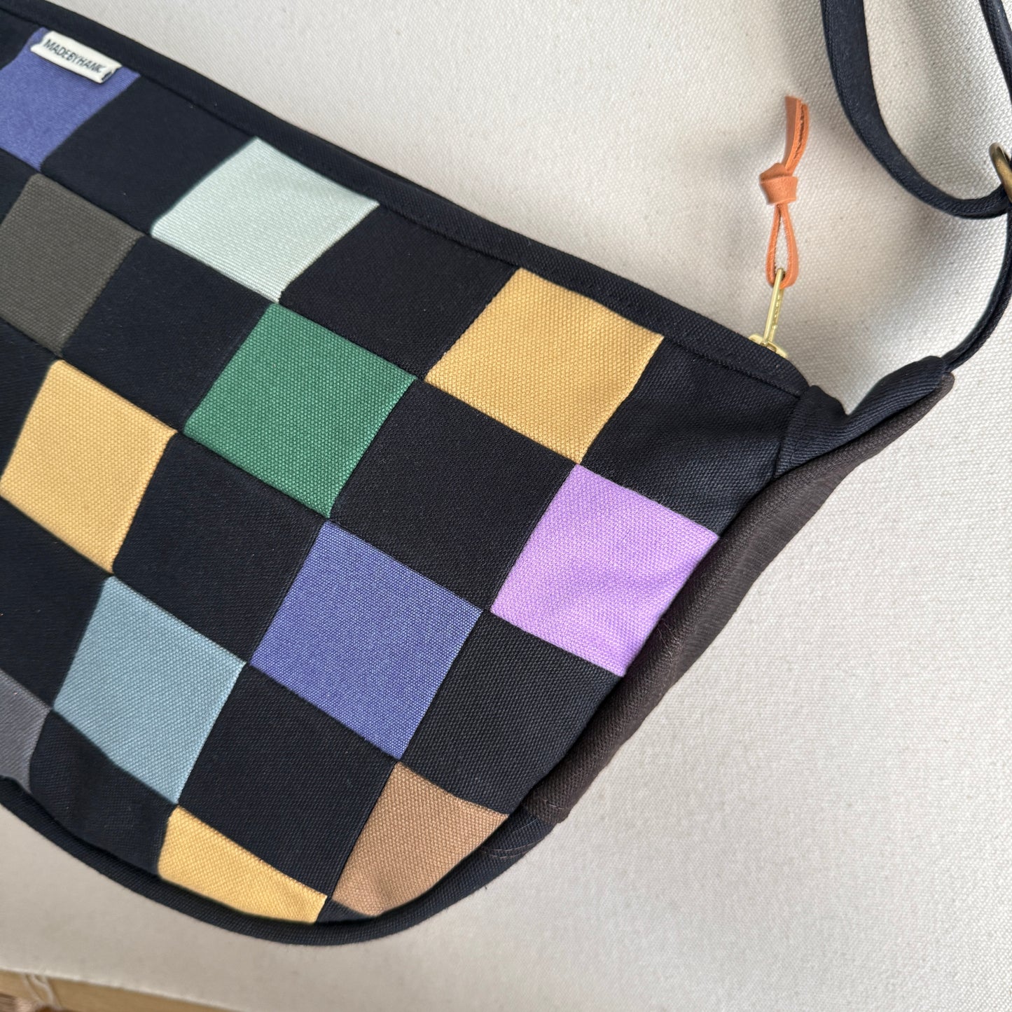 checkerboard crescent bag, black with multi