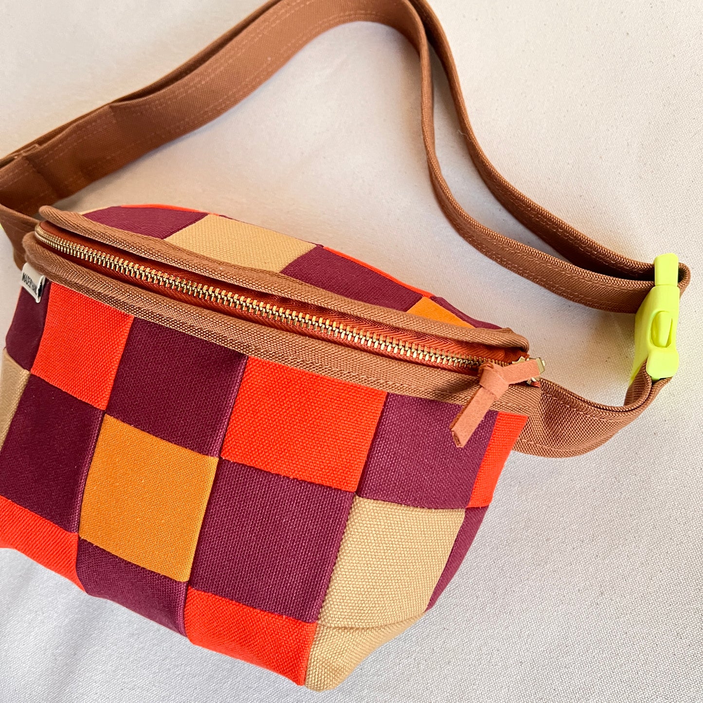 checkerboard fanny bag, honey/hot orange/wine (with neon buckle!)
