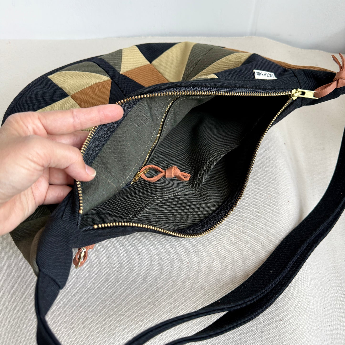 crescent shoulder bag, black with honey/ forest/caramel