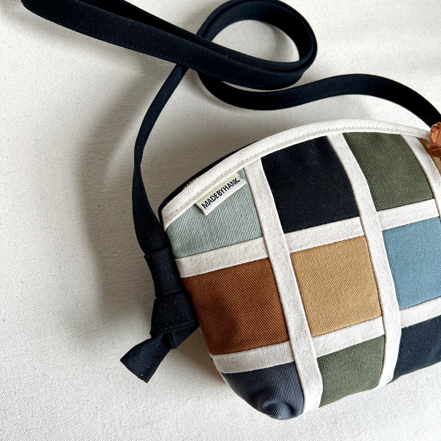double-sided grid bag, natural and muted shades/ black with and muted shades