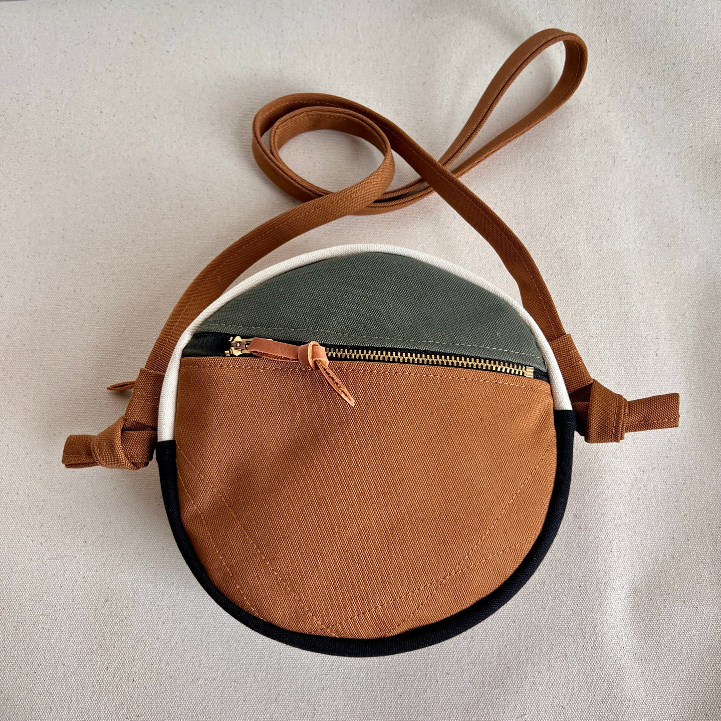 circle crossbody, pinwheel star