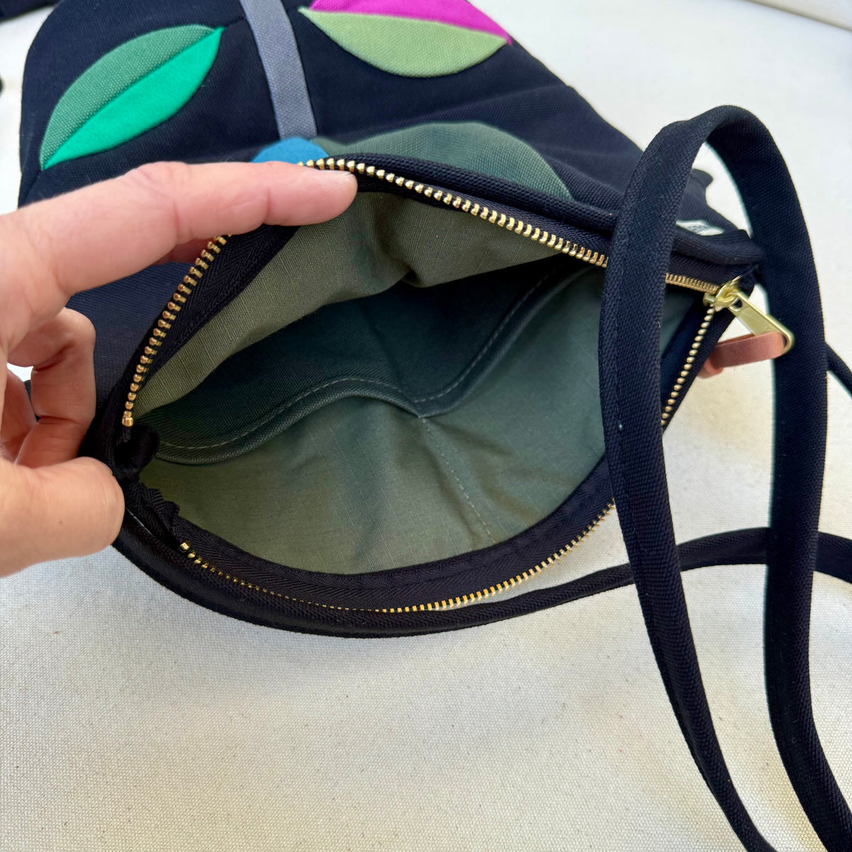 The Emmy Crossbody, pieced work tulip in black with turquoise/jade/raspberry etc
