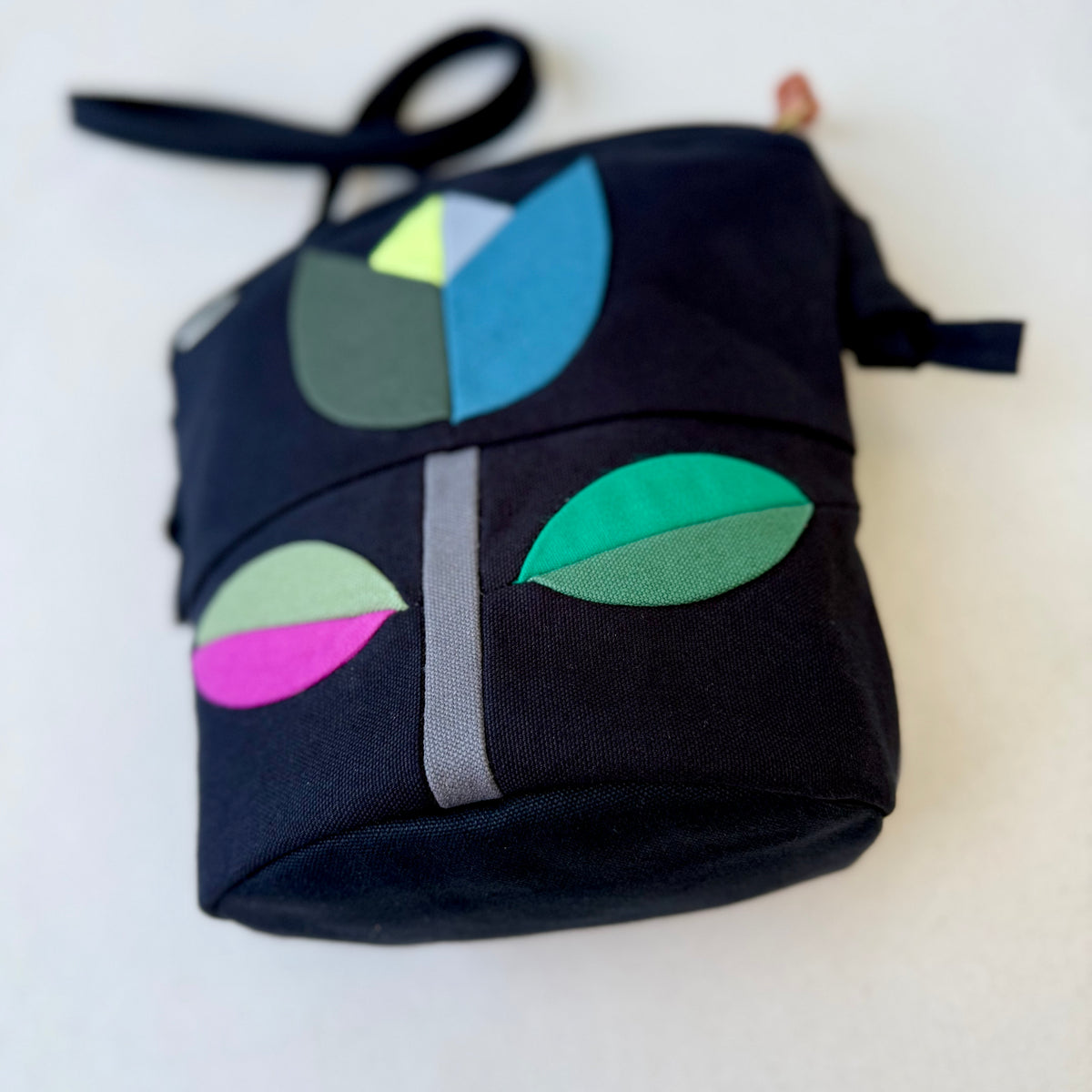 The Emmy Crossbody, pieced work tulip in black with turquoise/jade/raspberry etc