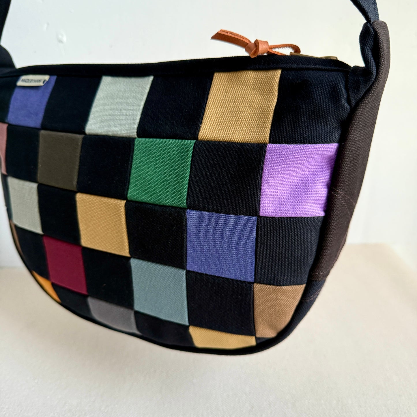 checkerboard crescent bag, black with multi