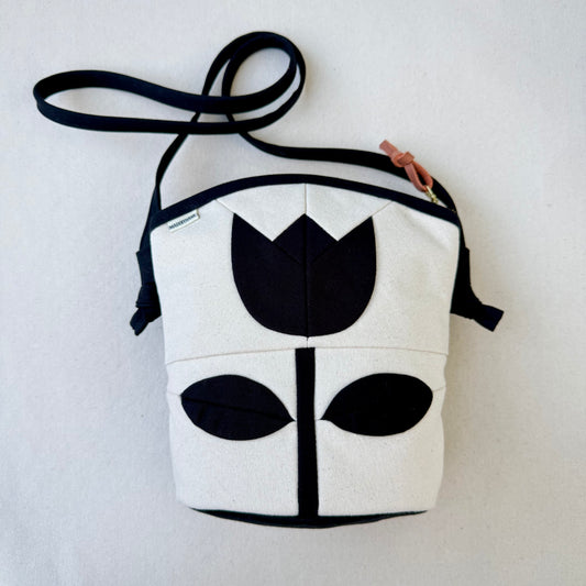 The Emmy Crossbody, pieced work tulip in natural and black