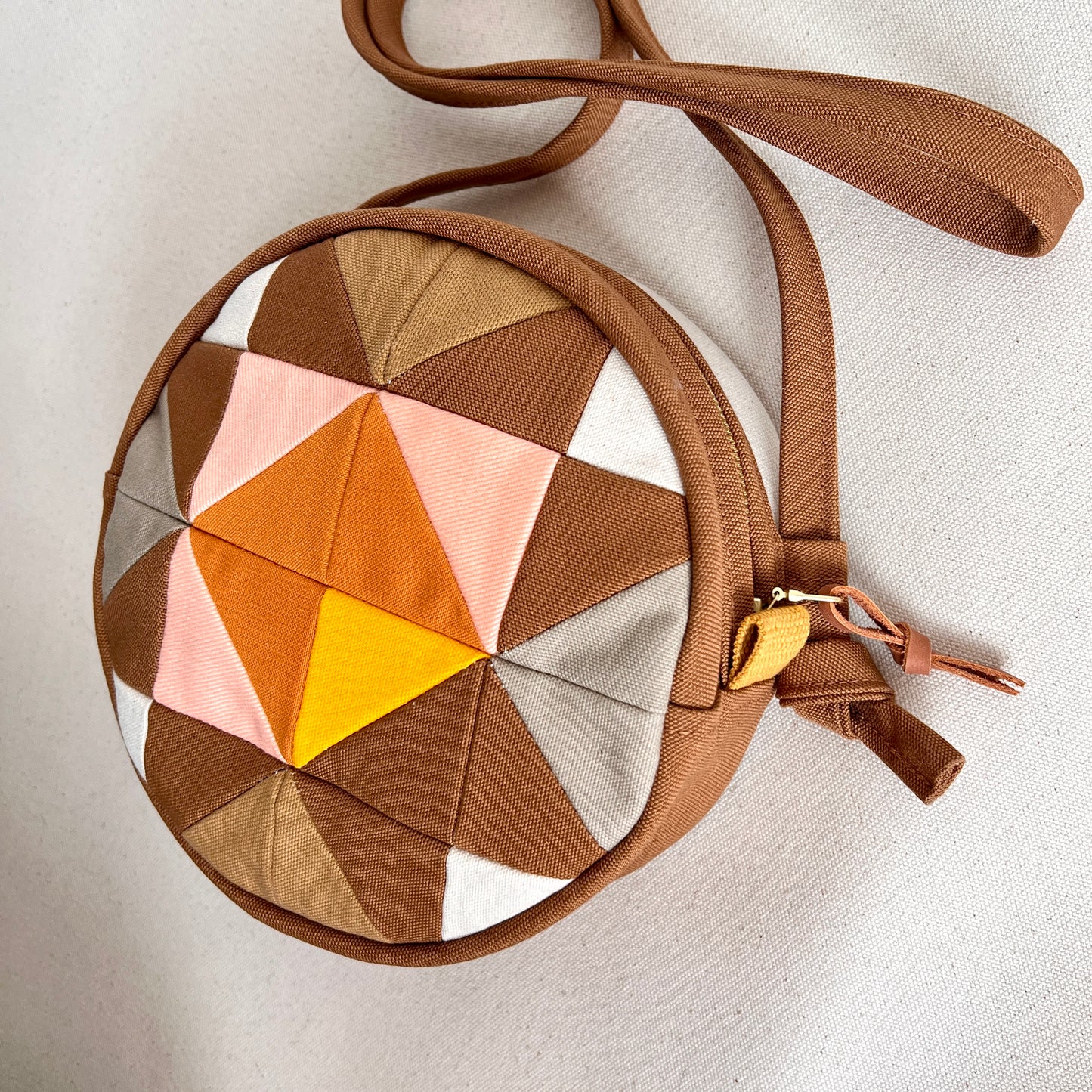 circle crossbody, caramel/ochre/sunshine/peach