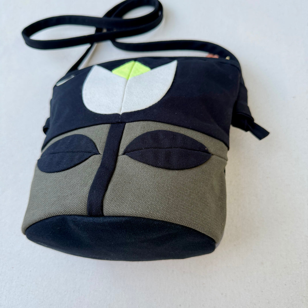 The Emmy Crossbody, pieced work tulip in dark olive/black/natural/neon