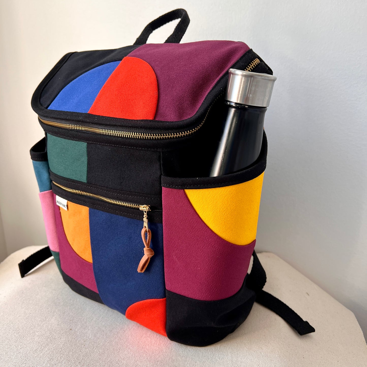 **PRE-ORDER**  NEW! Roomier Backpack with Side Pockets, Black with Brights