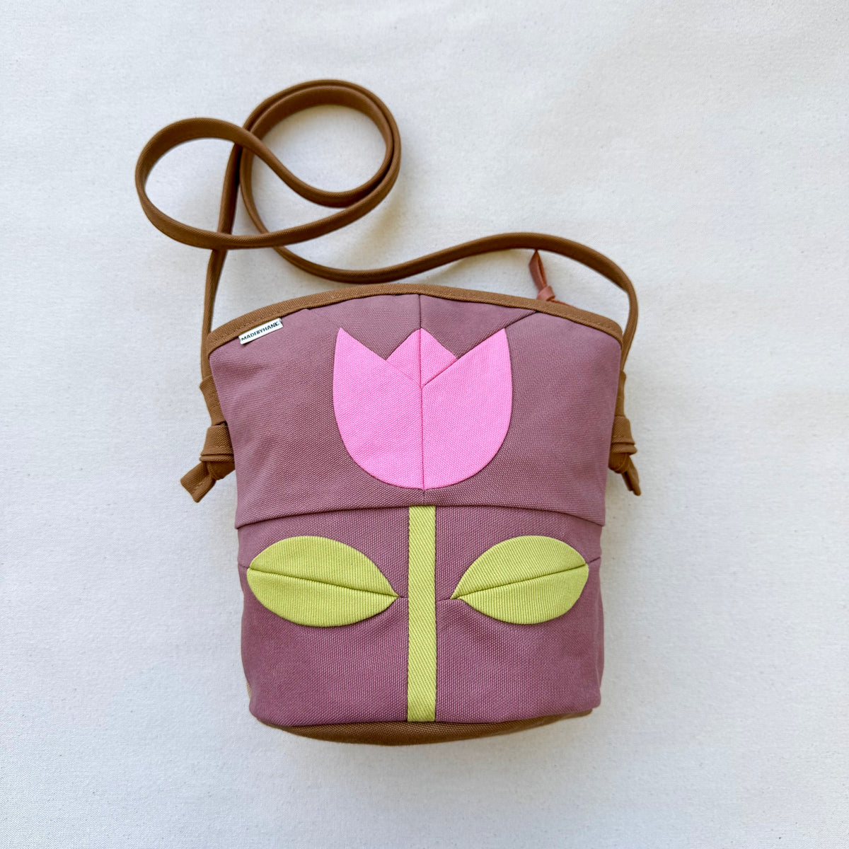 The Emmy Crossbody, pieced work tulip in mauve with flamingo pink and celery