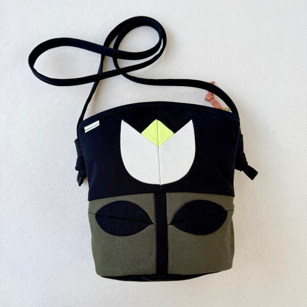The Emmy Crossbody, pieced work tulip in dark olive/black/natural/neon