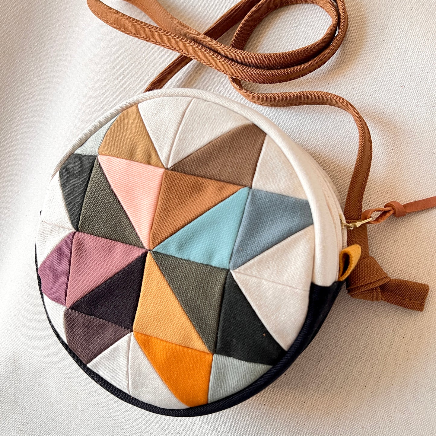 circle crossbody, pinwheel star