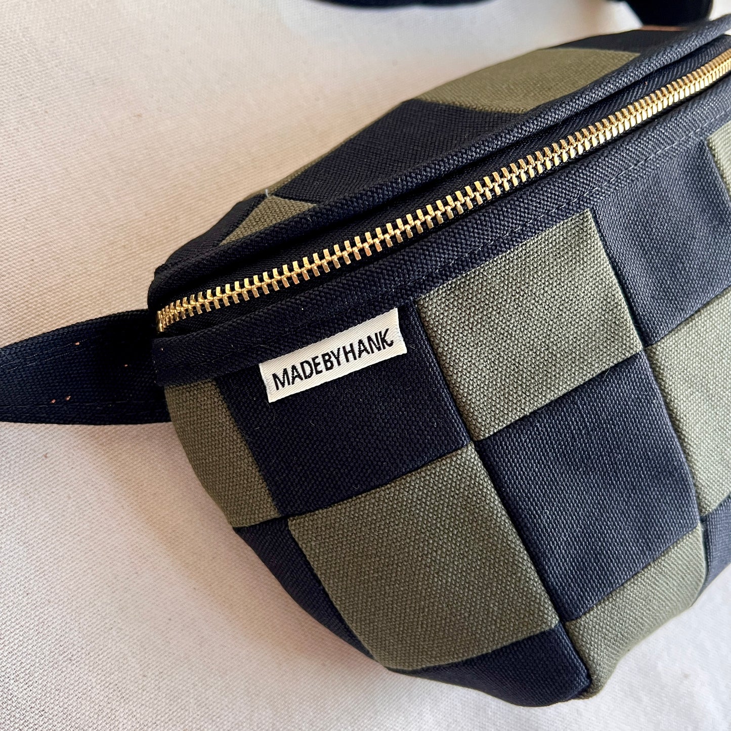 checkerboard fanny bag, black+forest with caramel