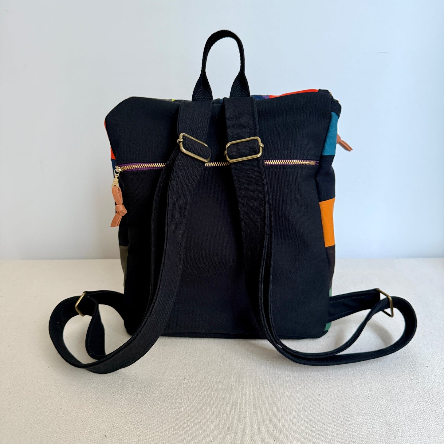 original size backpack, party triangles (black)