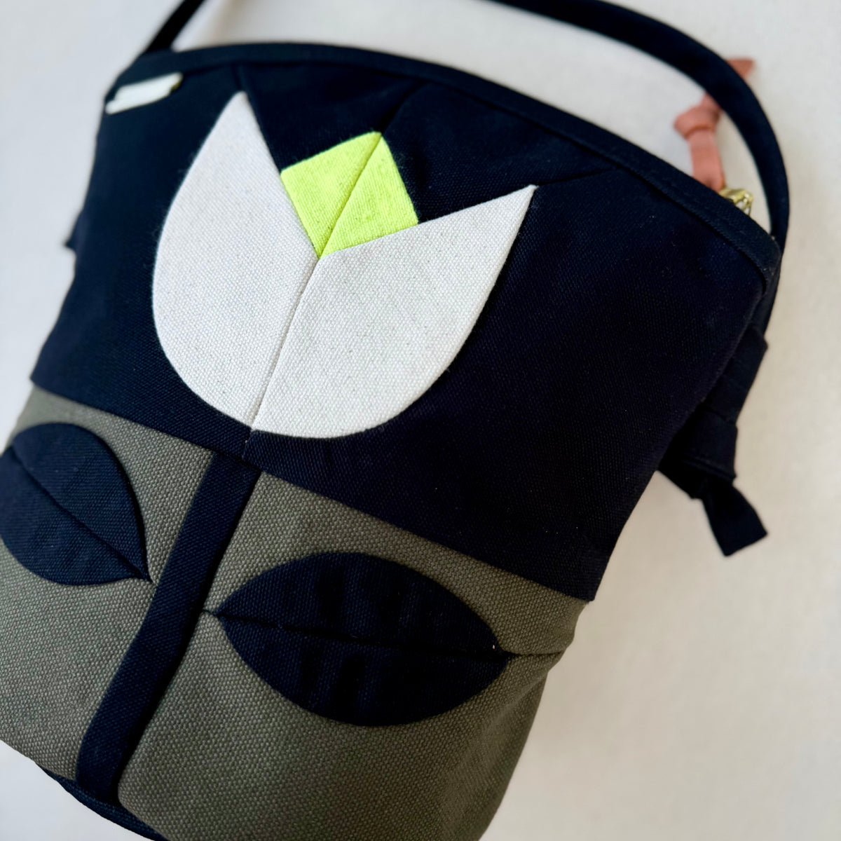 The Emmy Crossbody, pieced work tulip in dark olive/black/natural/neon