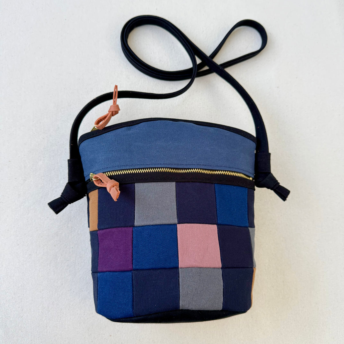 The Emmy Crossbody, pieced work tulip in midnight and dusk blue with purples+mauves