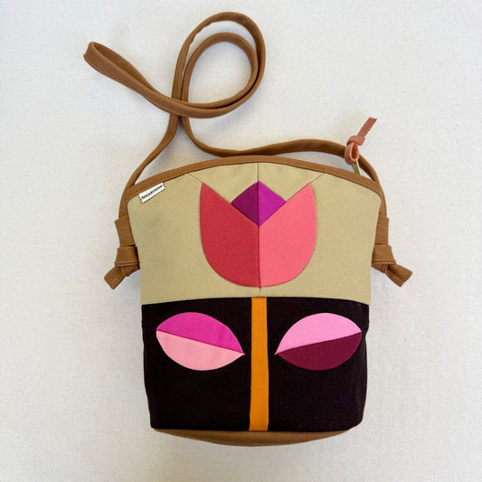 The Emmy Crossbody, pieced work tulip in honey and espresso with pinks