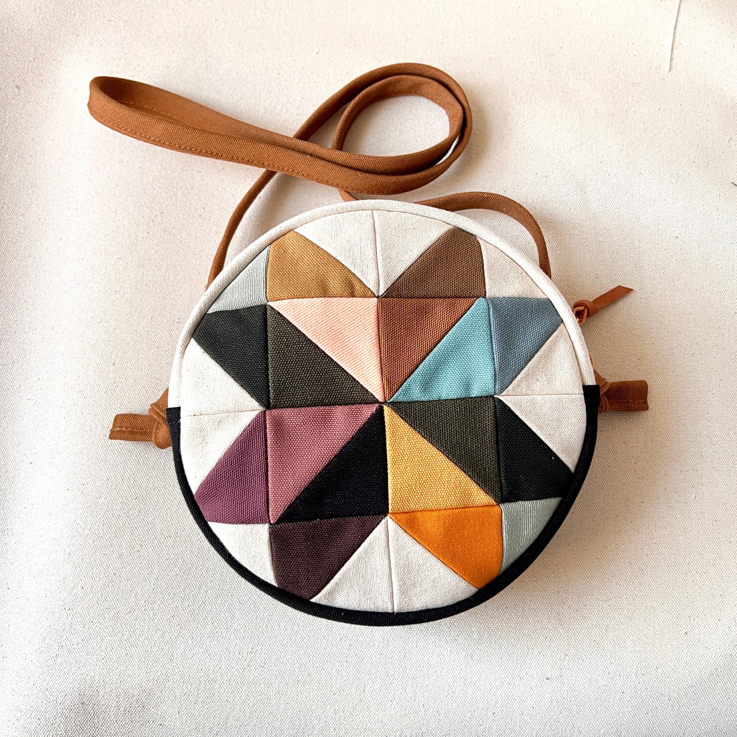 circle crossbody, pinwheel star