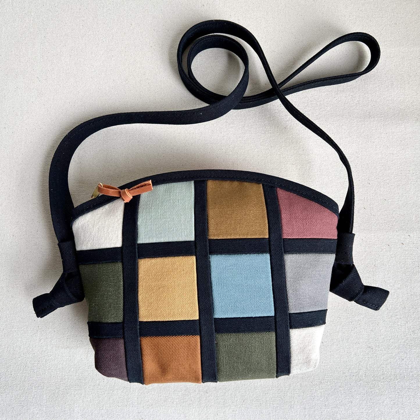 double-sided grid bag, natural and muted shades/ black with and muted shades